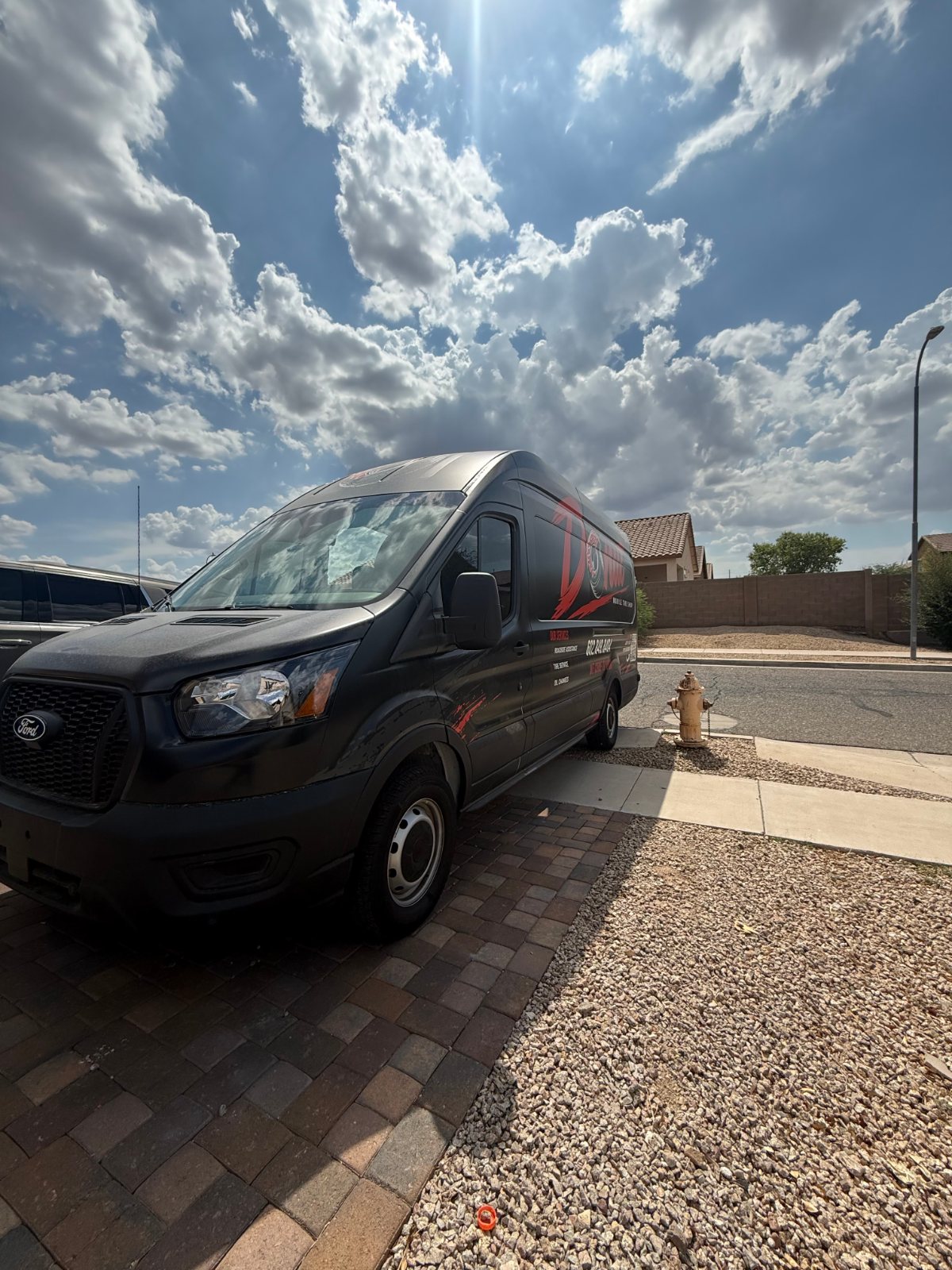 Donut Mobile Tire van at a customer driveway